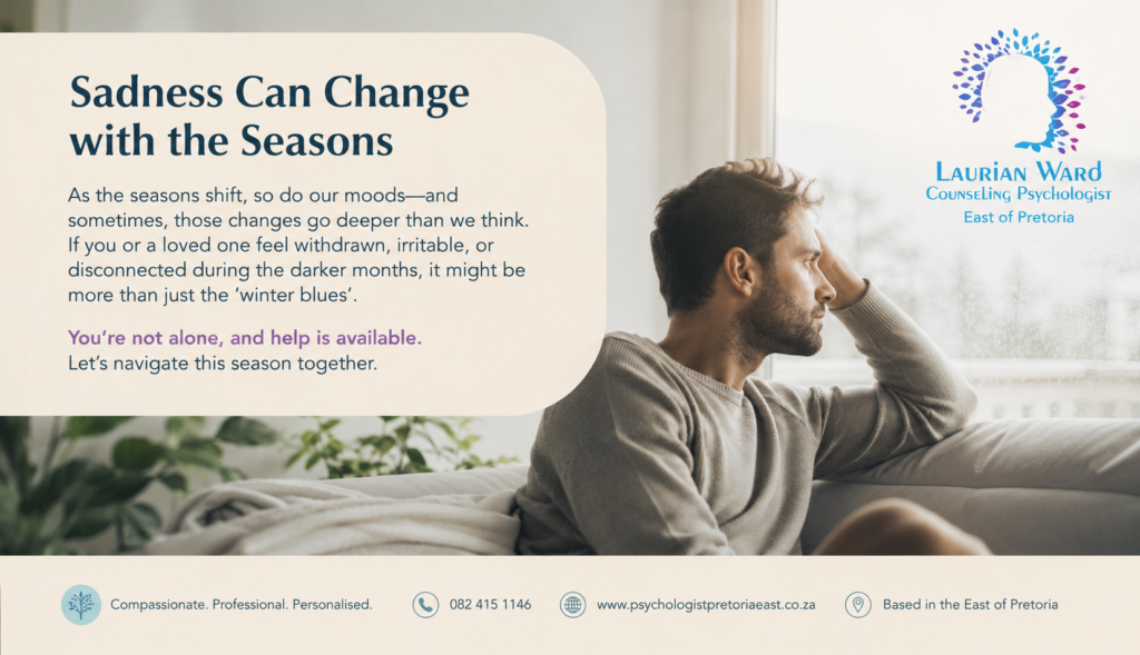 a man sitting on a couch starring in to the garden because of seasonal sadness